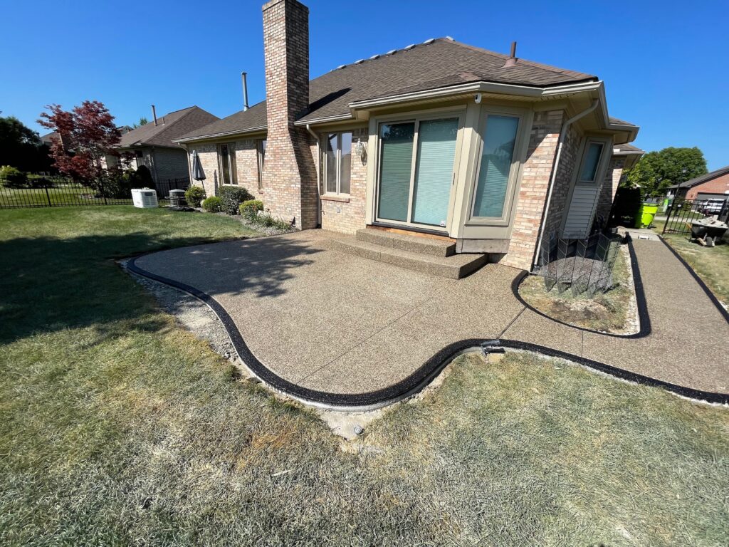 exposed aggregate patio with stained border